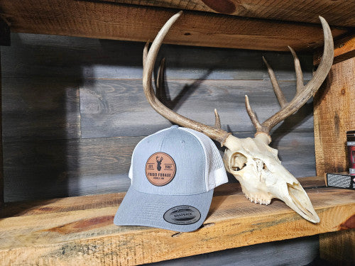 Frigid Forage Trucker Snapback hats with leather patch.     Heather/White